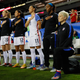 Megan Rapinoe kneels during the national anthem before game in 2016. U.S. Soccer overturned a rule requiring players to stand for the anthem.